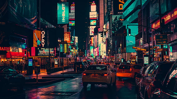 cars-on-road-surrounded-by-building-during-nighttime-thumbnail.jpg