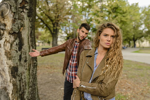 Woman And Man Wearing Brown Jackets Standing Near Tree, angry HD wallpaper