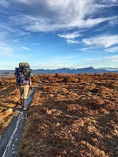 Photo of Man Walking , adult, adventure, backpack, clouds, daylight HD wallpaper