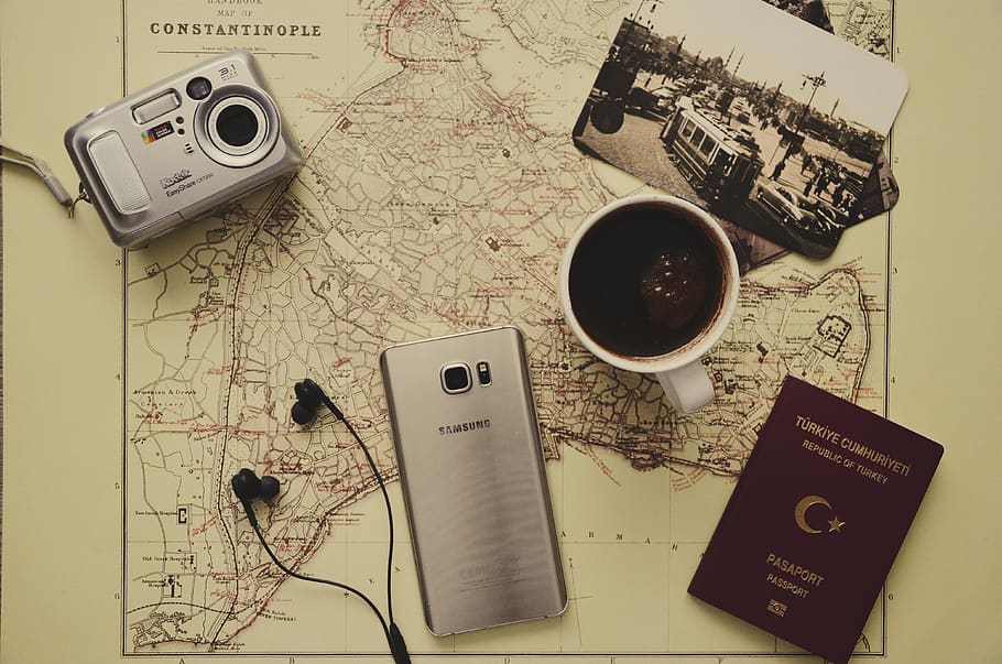 Silver Camera Near Black Coffee in Mug, Silver Samsung Galaxy S7, Turkey Passport, and Black Earbuds, HD wallpaper
