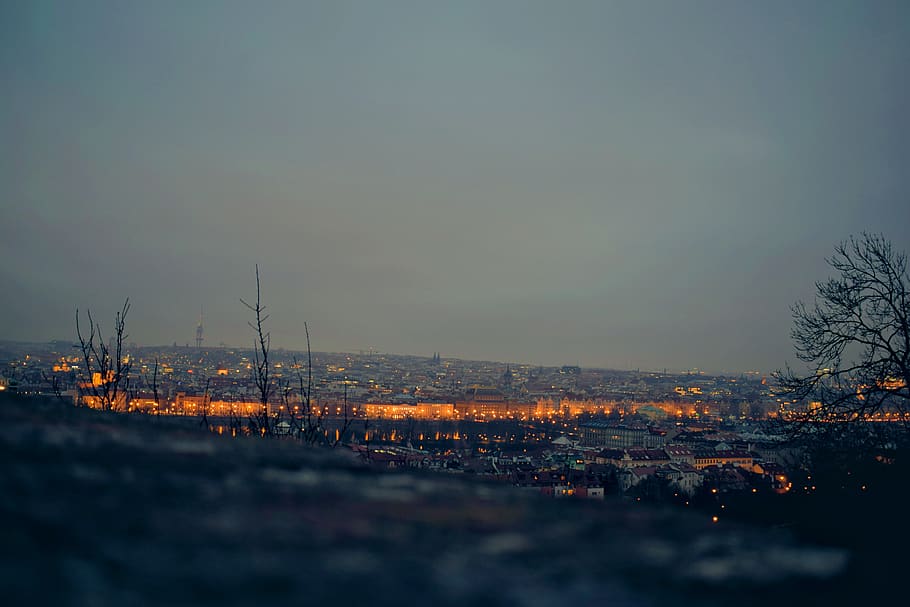 lighted city under gray clouds, nature, landscape, outdoors, scenery HD wallpaper