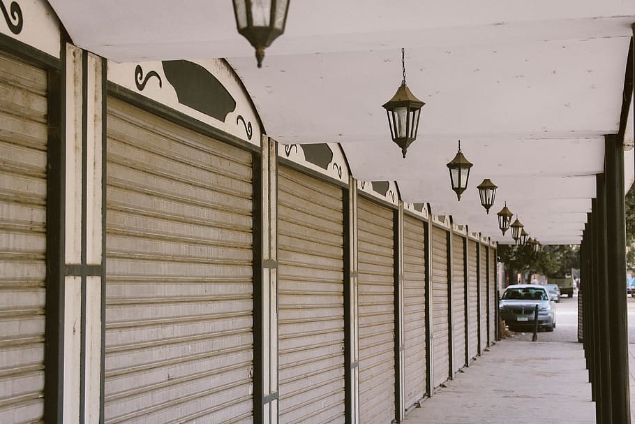 Wide Angle Photo of Gray Roller Shutters, building, cars, ceiling HD wallpaper
