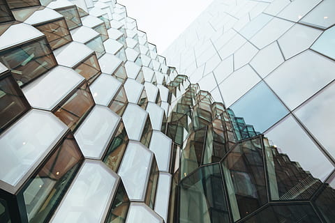 Exterior of a building with modern glass architecture, bright HD wallpaper