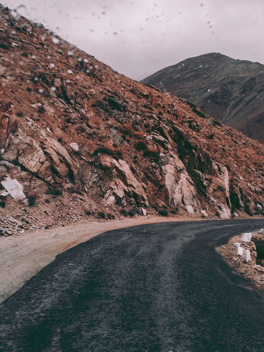 View of Empty Road Near Mountains, asphalt, cliffs, curve, daylight HD wallpaper