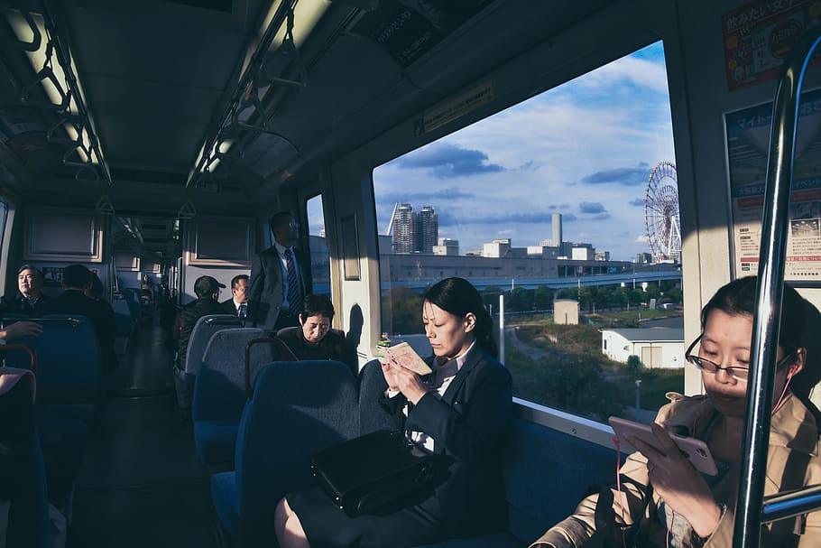 people inside train while reading book, cushion, human, person HD wallpaper