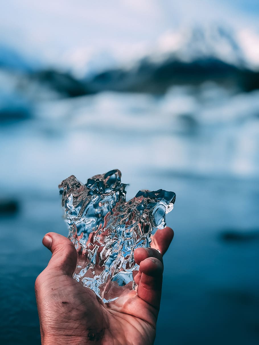 selective focus photography of person holding ice, hand, lake HD wallpaper