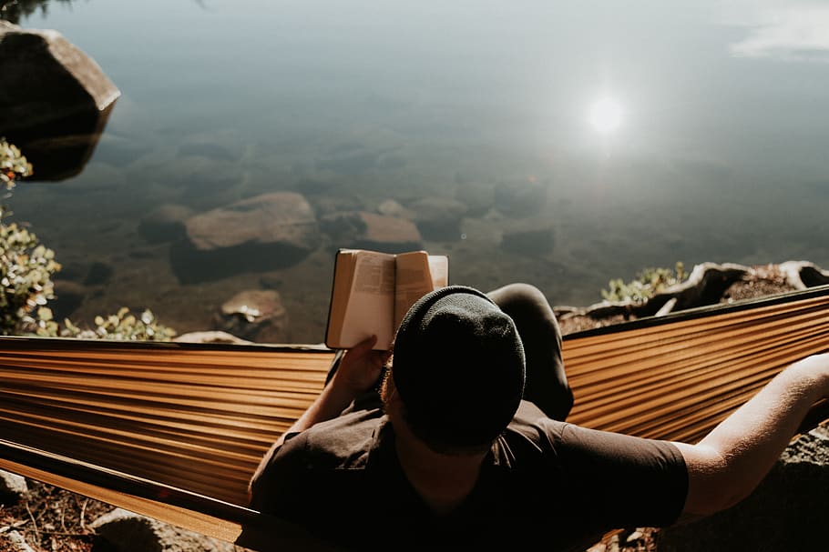 mam sitting on hammock reading book, one person, nature, real people HD wallpaper