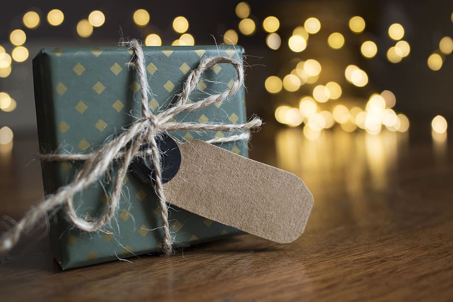 Selective Focus Photography Of Gift Box On Brown Wooden Surface HD wallpaper