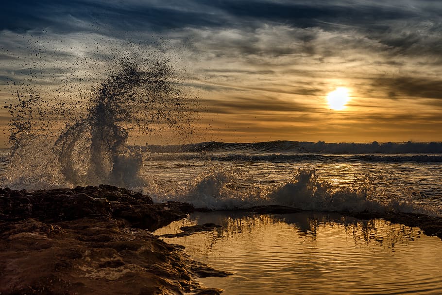 spain, water, splash, sunset, sea, waves, sky, beauty in nature HD wallpaper