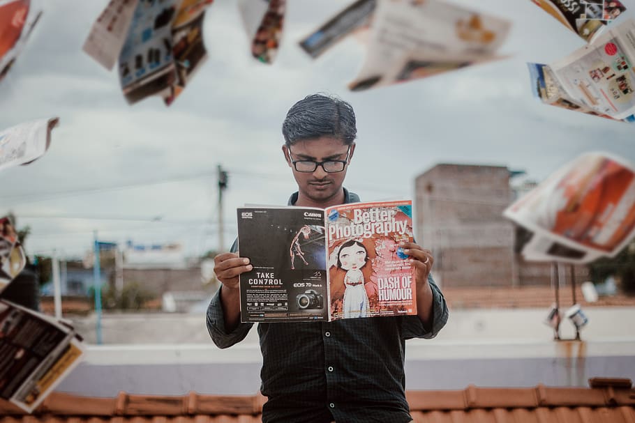 man reading magazine while standing, one person, real people HD wallpaper