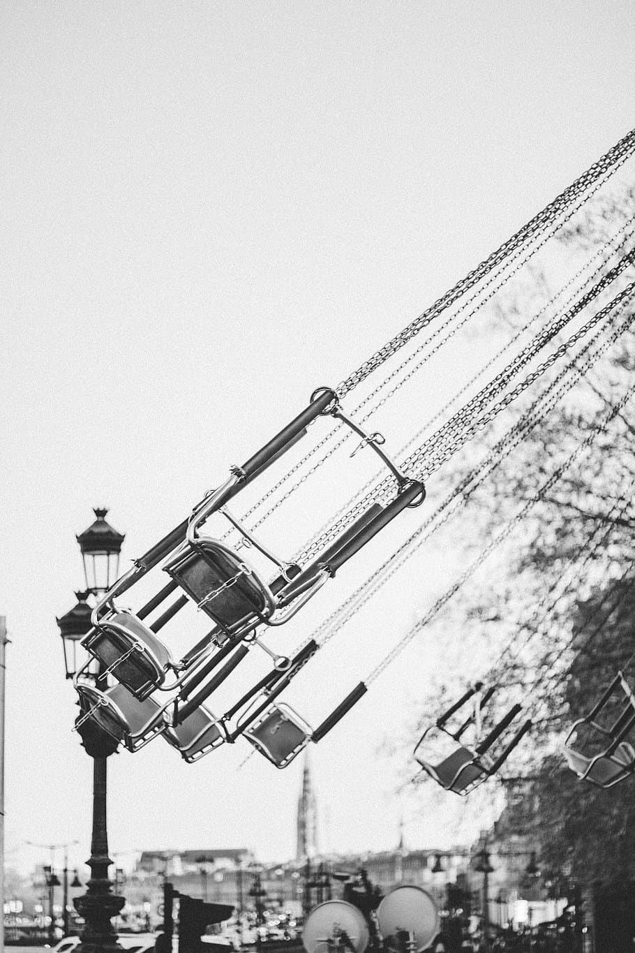 grayscale photo of empty swing rids, sky, building exterior, architecture