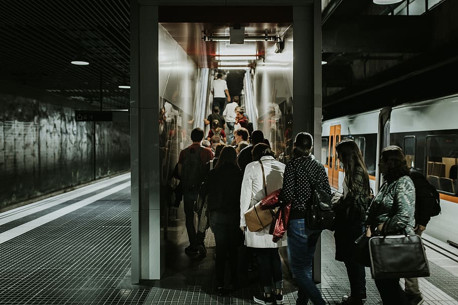 Grayscale Photography of People Falling in Line at Train Station HD wallpaper