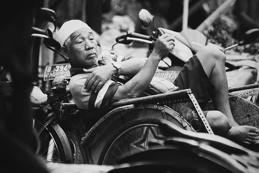 grayscale photography of man sitting on motorcycle, wheel, machine