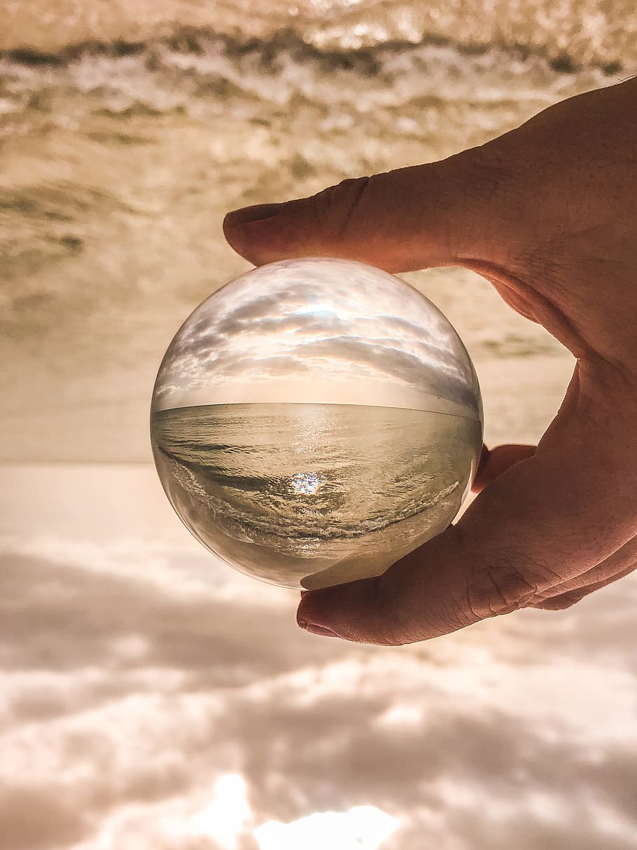 Shallow Focus Photo Of Glass Ball, ball-shaped, beach, hand, macro HD wallpaper