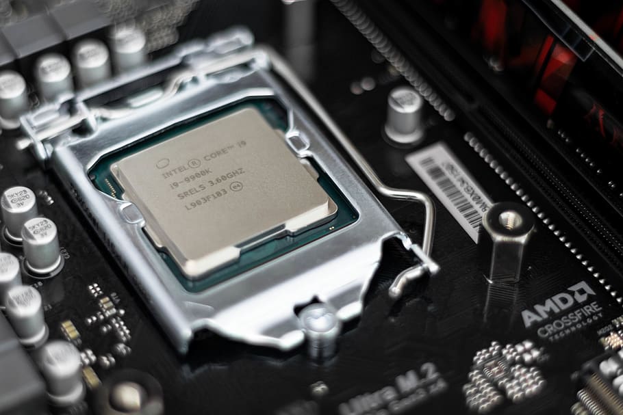 Intel processor on black motherboard, indoors, technology, no people HD wallpaper