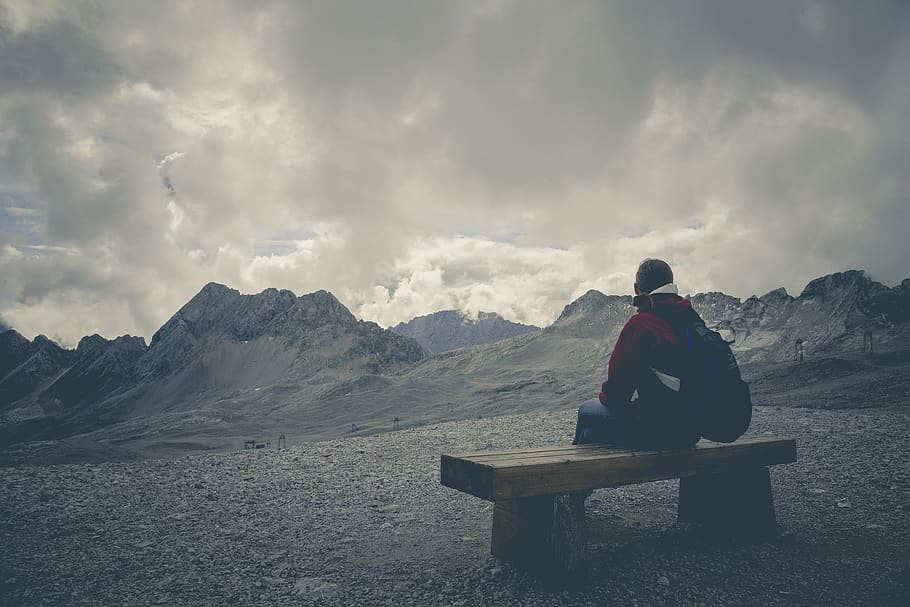 Man in Red Jacket Sitting on Brown Wooden Bench, clouds, cloudy HD wallpaper