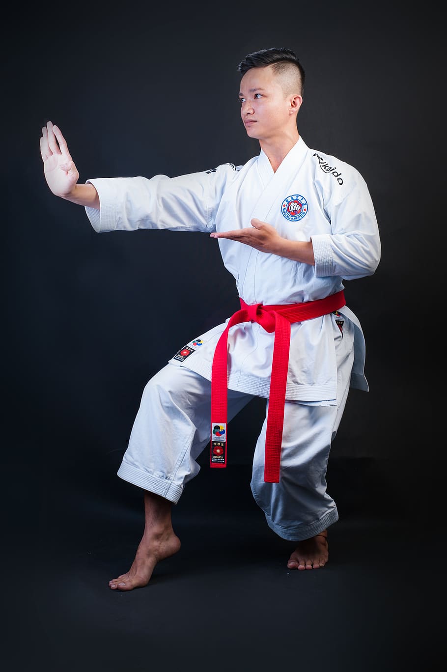 man standing wearing white karate gi, human, person, sport, martial arts