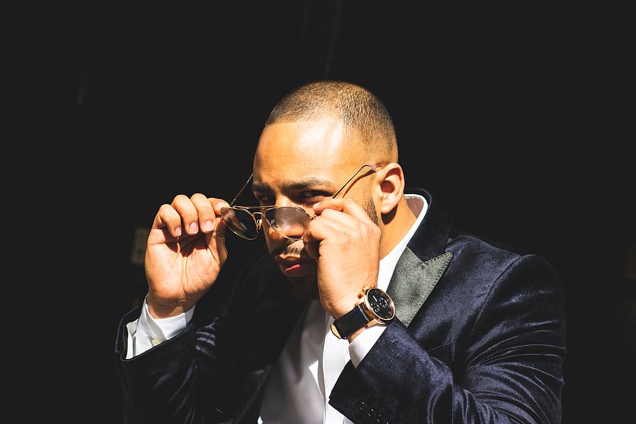 Man in Blue Suit Jacket Taking Off Sunglasses, bald, close-up HD wallpaper
