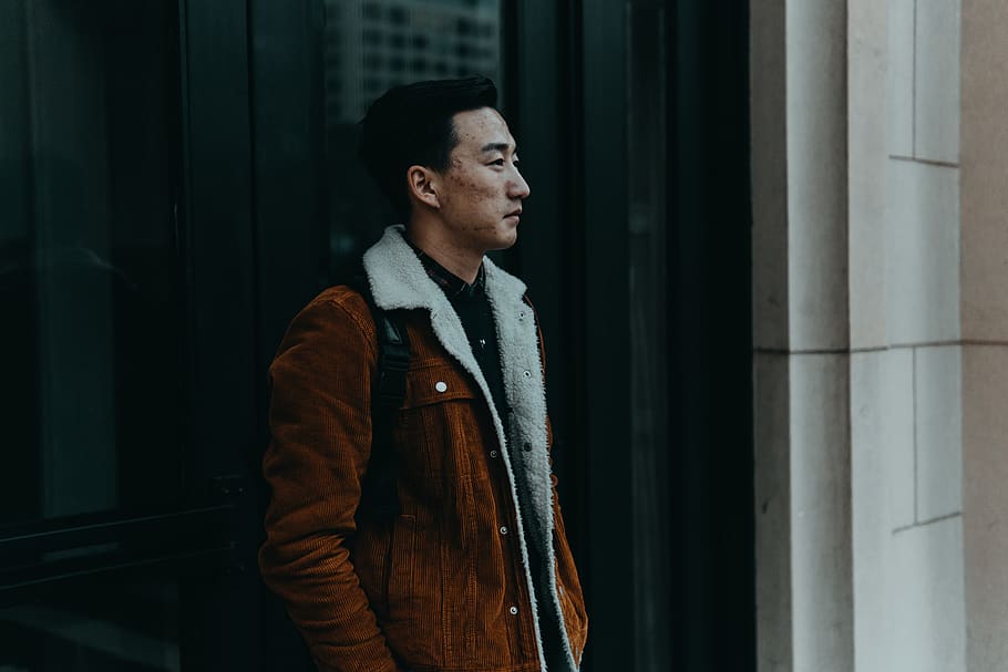 man standing beside door, one person, young adult, looking, young men HD wallpaper