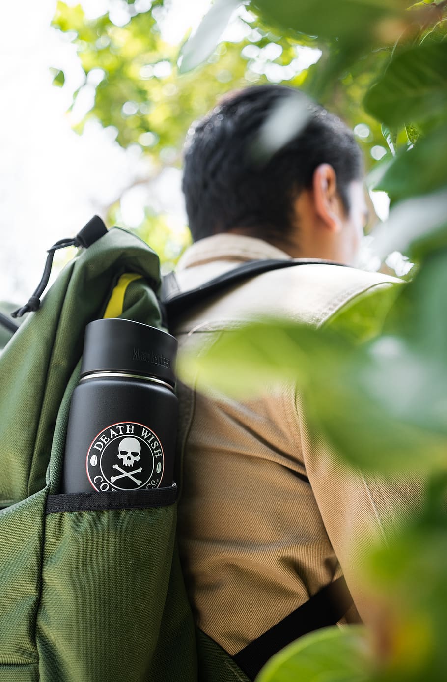 man wearing green backpack, real people, day, men, focus on foreground HD wallpaper