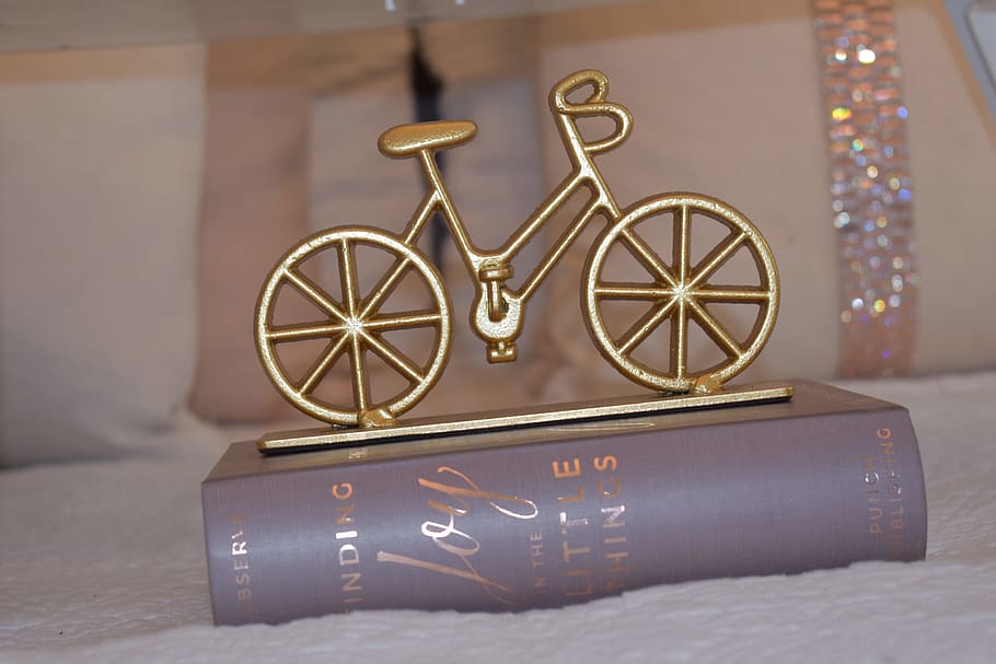 Brass-colored Bike Table Decor, bed, bicycle, book, close -up HD wallpaper