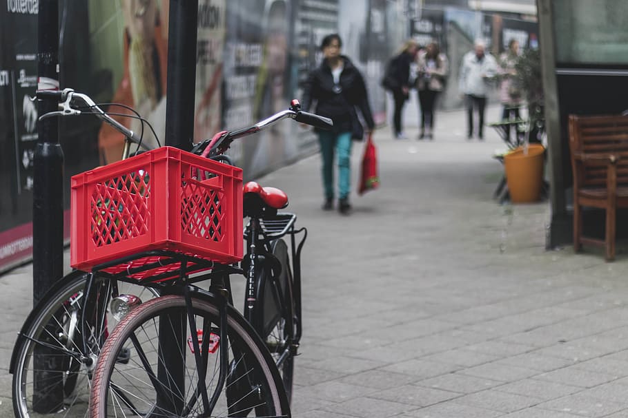 Two Black Bicycles on Post, basket, bikes, pavement, Rotterdam HD wallpaper