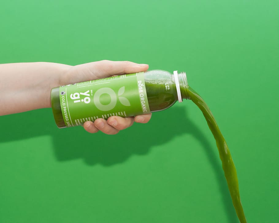 Yogi plastic bottle, human hand, green color, holding, one person HD wallpaper