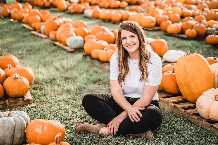 woman sitting next to pumpkins, portrait, patch, halloween, female HD wallpaper