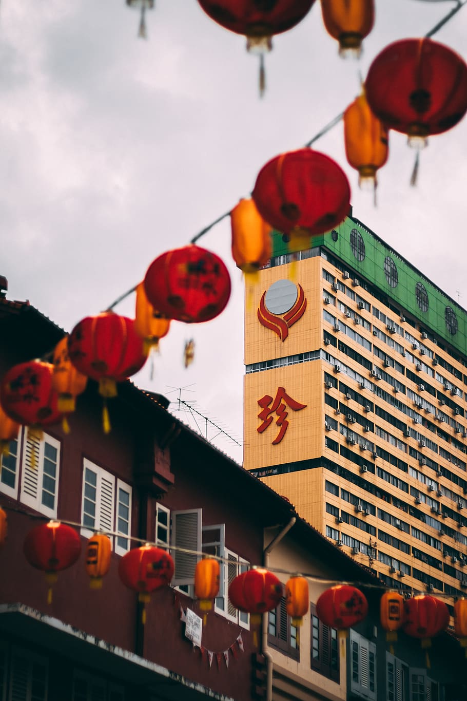 red Chinese lantern during daytime, toy, lamp, building, crowd