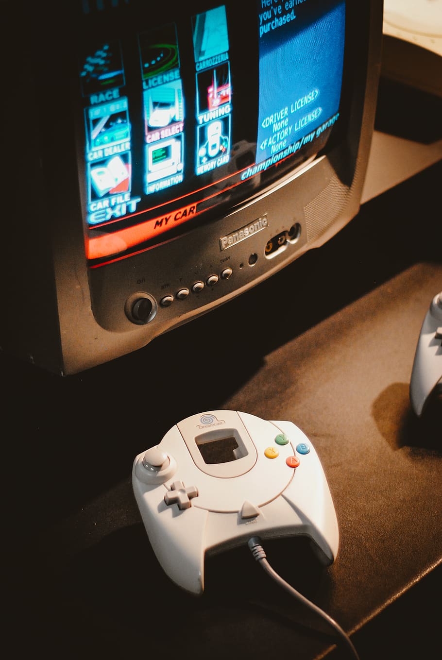 white corded game controller on brown surface, technology, no people HD wallpaper