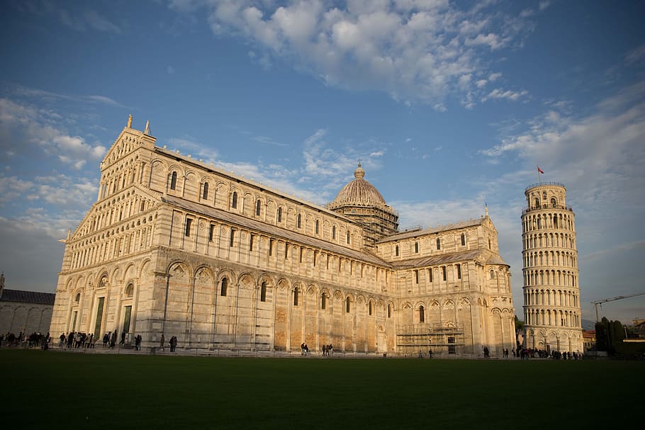 Pisa Cathedral with the Leaning Tower of Pisa in sunlight, arches