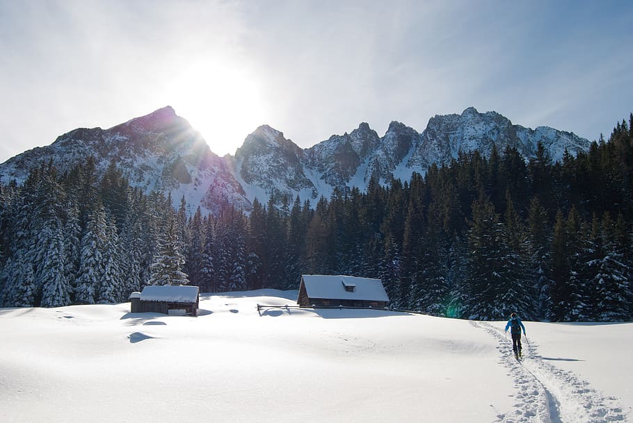 Man Walking Towards Brown Housen in a Snow Place, alpine, ascent HD wallpaper