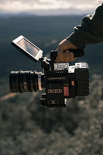man holding black professional camcorder, film camera, lens, hand HD wallpaper