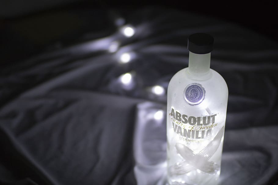 absolut, vodca, botle, light, bottle, container, indoors, text