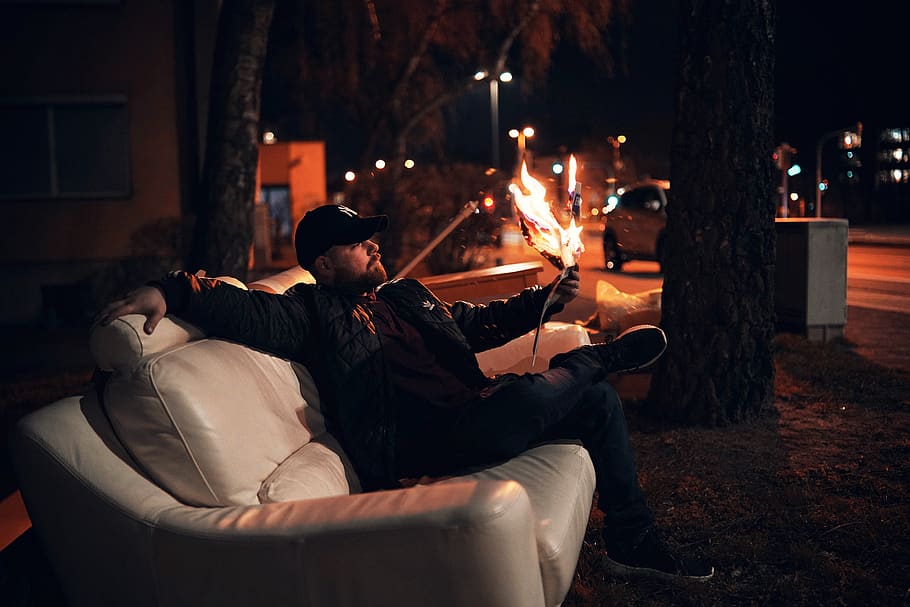 man sitting on white leather sofa at night, real people, men, HD wallpaper