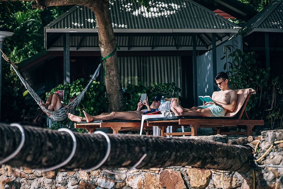 Man Sitting on Brown Wooden Lounger, group, hammock, leisure HD wallpaper