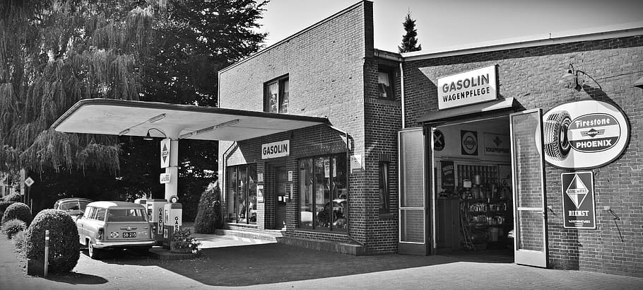 Gray Scale Photo of a Sedan Parked Infront of Store, architecture