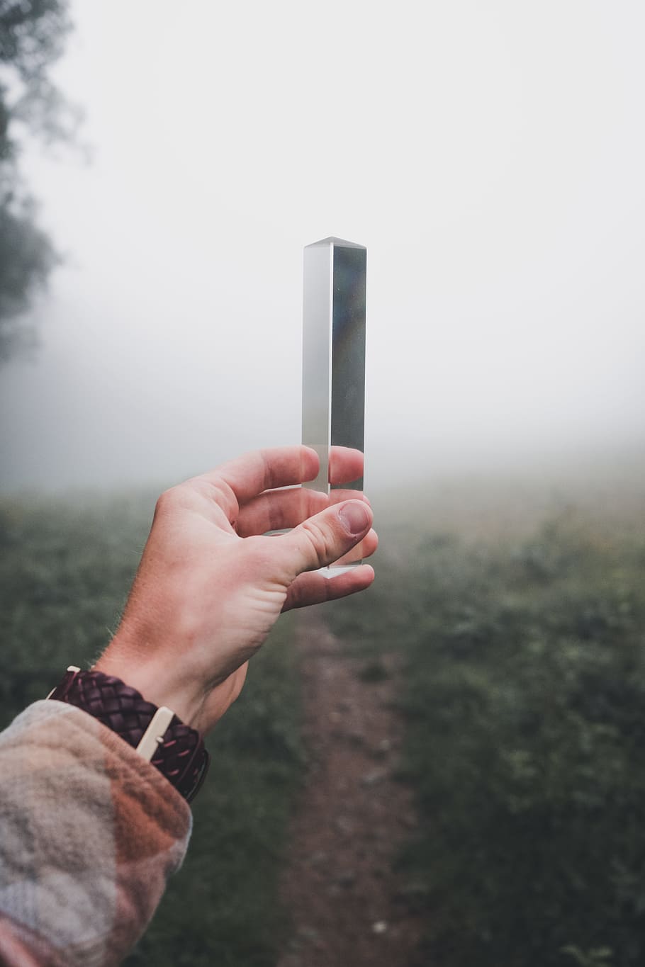 person holding gray steel box, object, triangle, hand, bokeh HD wallpaper