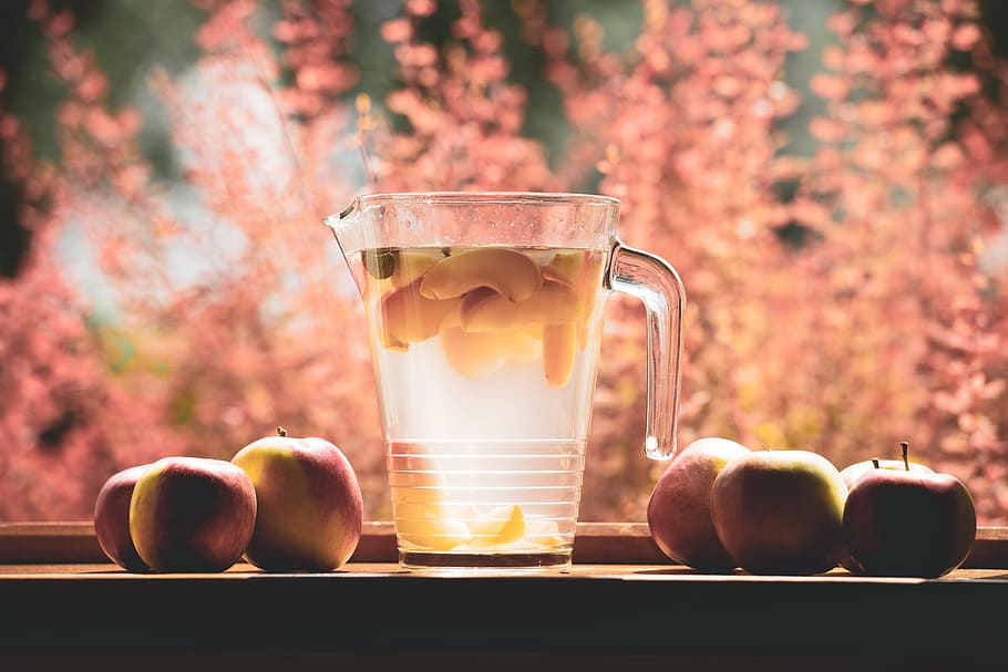 clear glass pitcher filled with clear liquid selective focus photography HD wallpaper