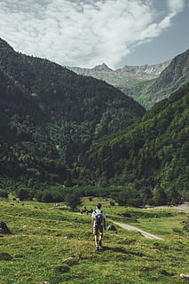 man walking alone going on mountain, nature, outdoors, mountain range HD wallpaper