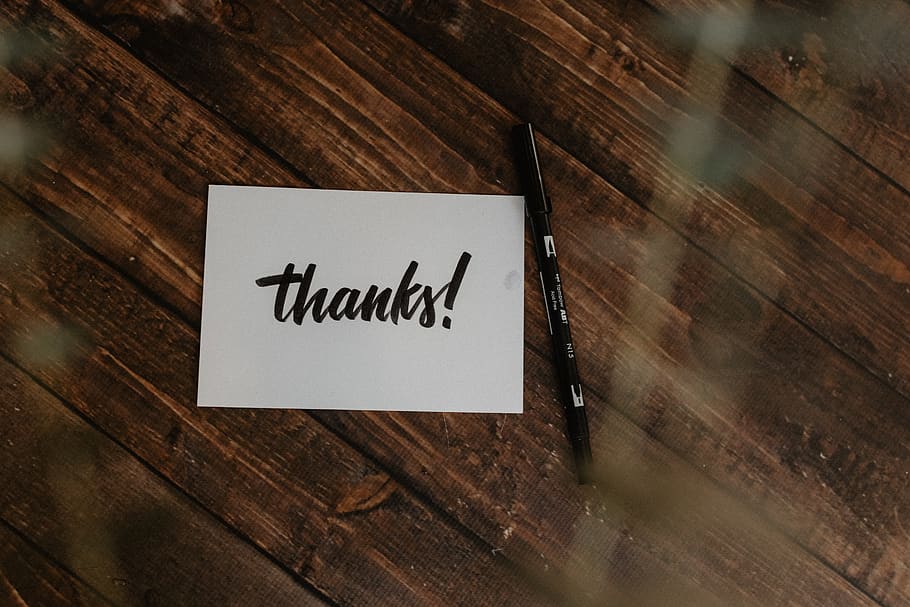 thanks! paper and black pen on wood surface, hardwood, plywood, HD wallpaper