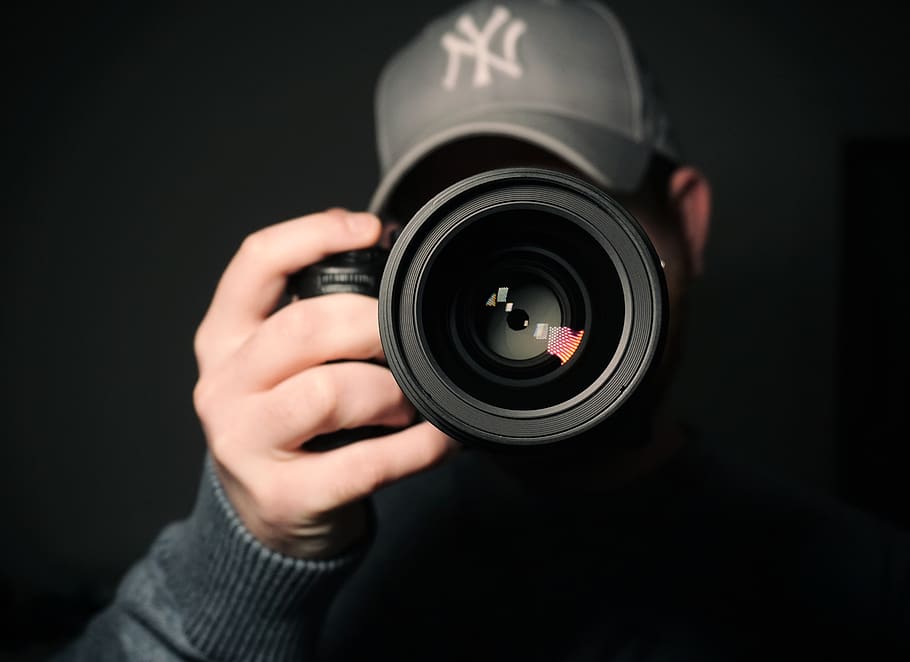 man holding camera, photography themes, camera - photographic equipment HD wallpaper