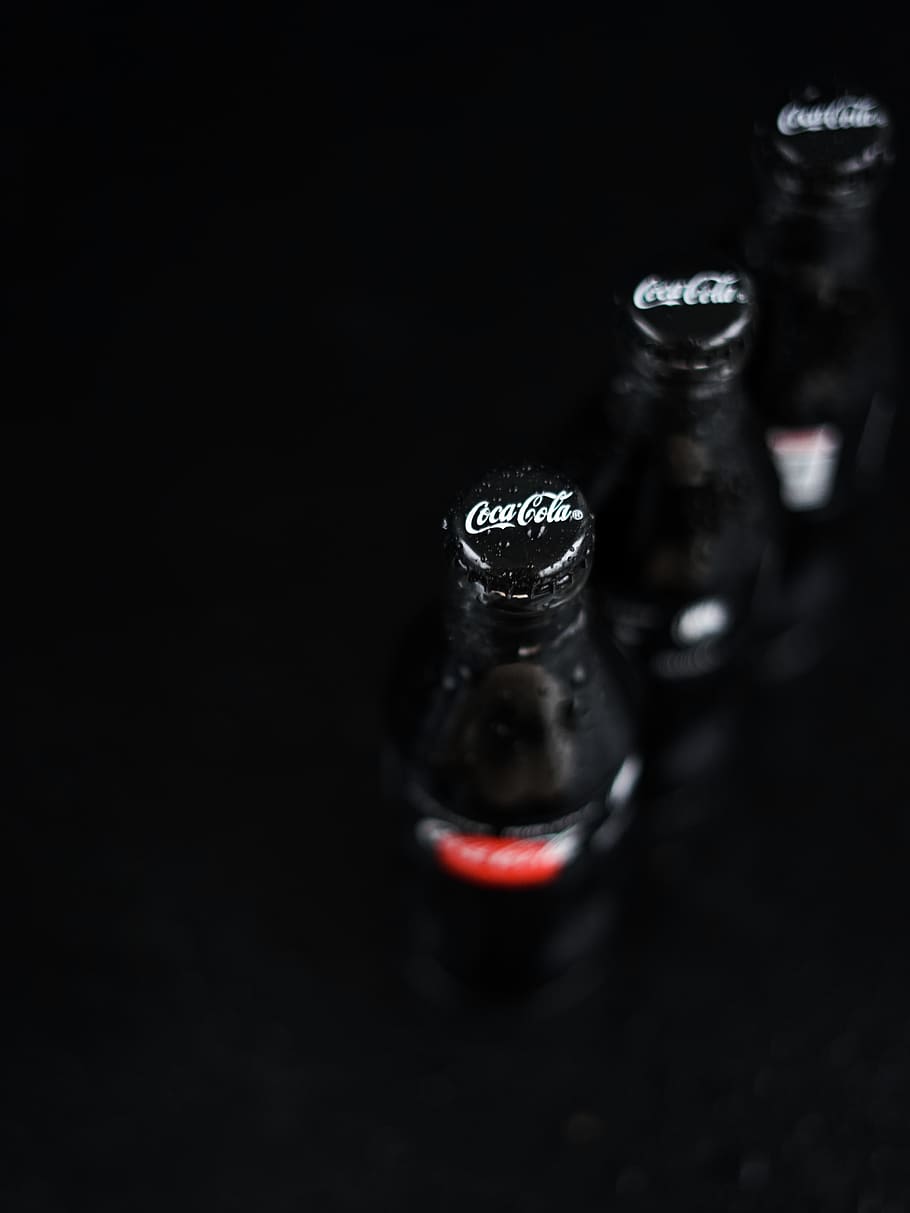 three Coca-Cola bottles, black background, studio shot, indoors, HD wallpaper