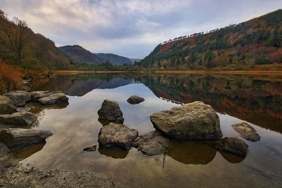 Body of Water With Rock Under White Sky, boulders, dawn, daylight HD wallpaper