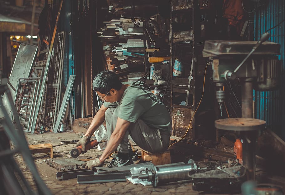 man holding angle grinder, one person, occupation, real people HD wallpaper