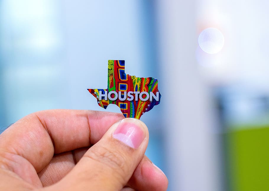 person holding Houston map decor, human hand, human body part HD wallpaper