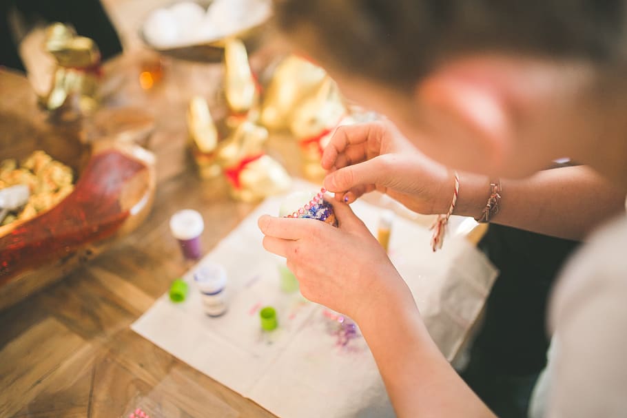 Close up of girl hands coloring eggs for easter II, blur, close-up HD wallpaper