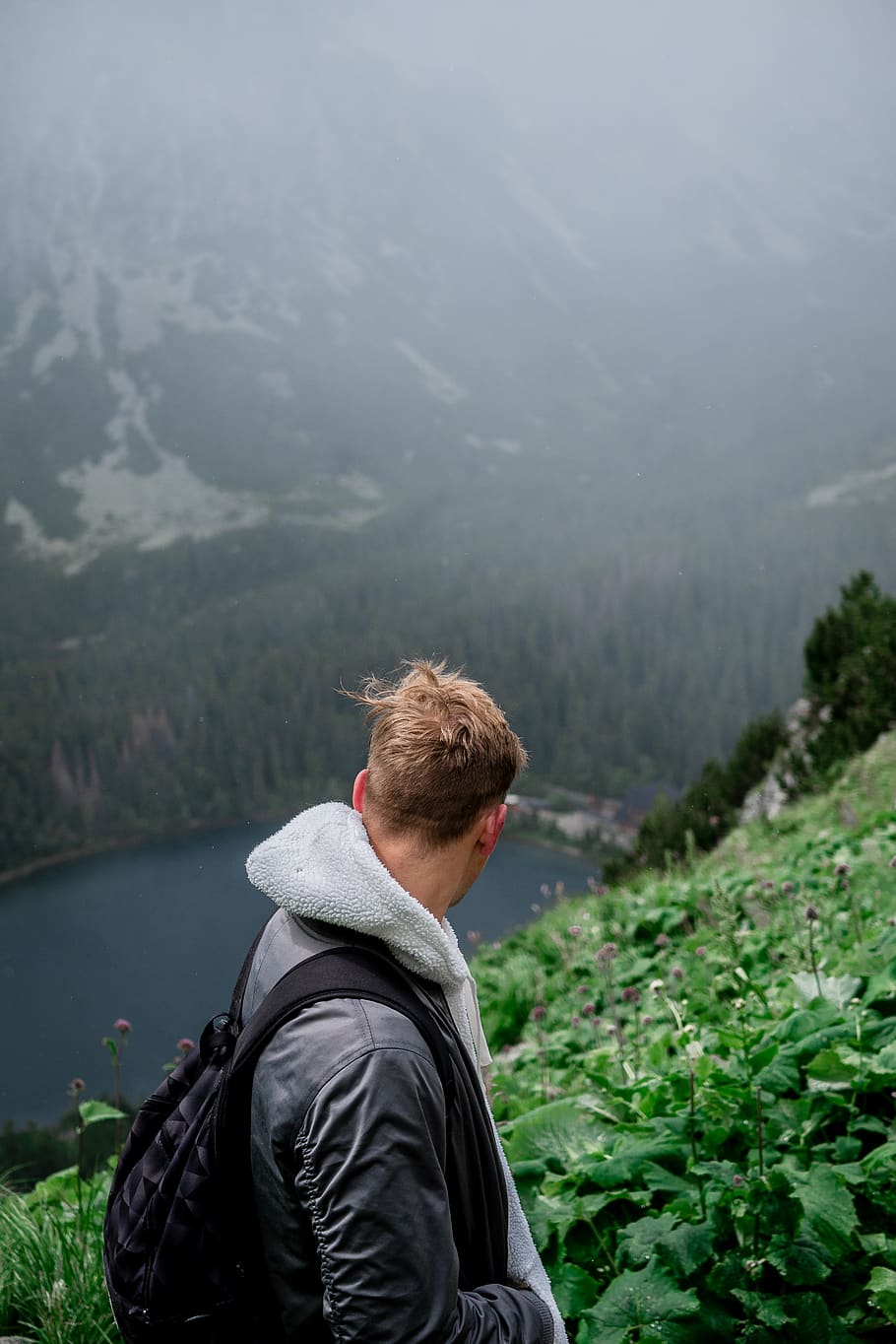 HD wallpaper: man standing on mountain overlooking lake during daytime ...