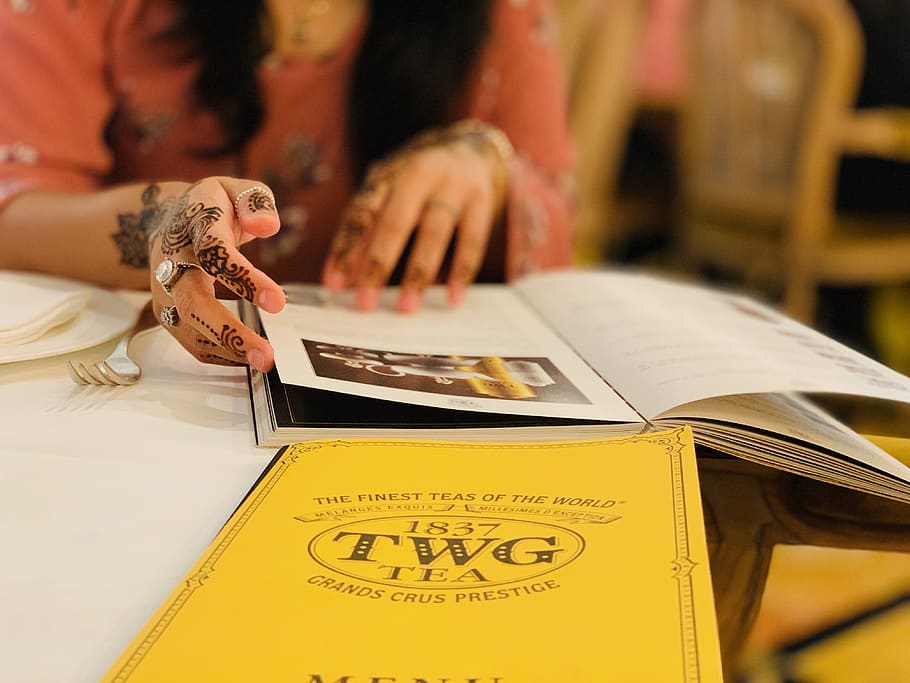 person flipping book, singapore, human, shoppes @ marina bay sands HD wallpaper