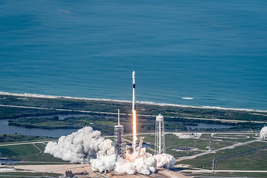 flying rocket on air at daytime, rocket launch, satellite, spacex